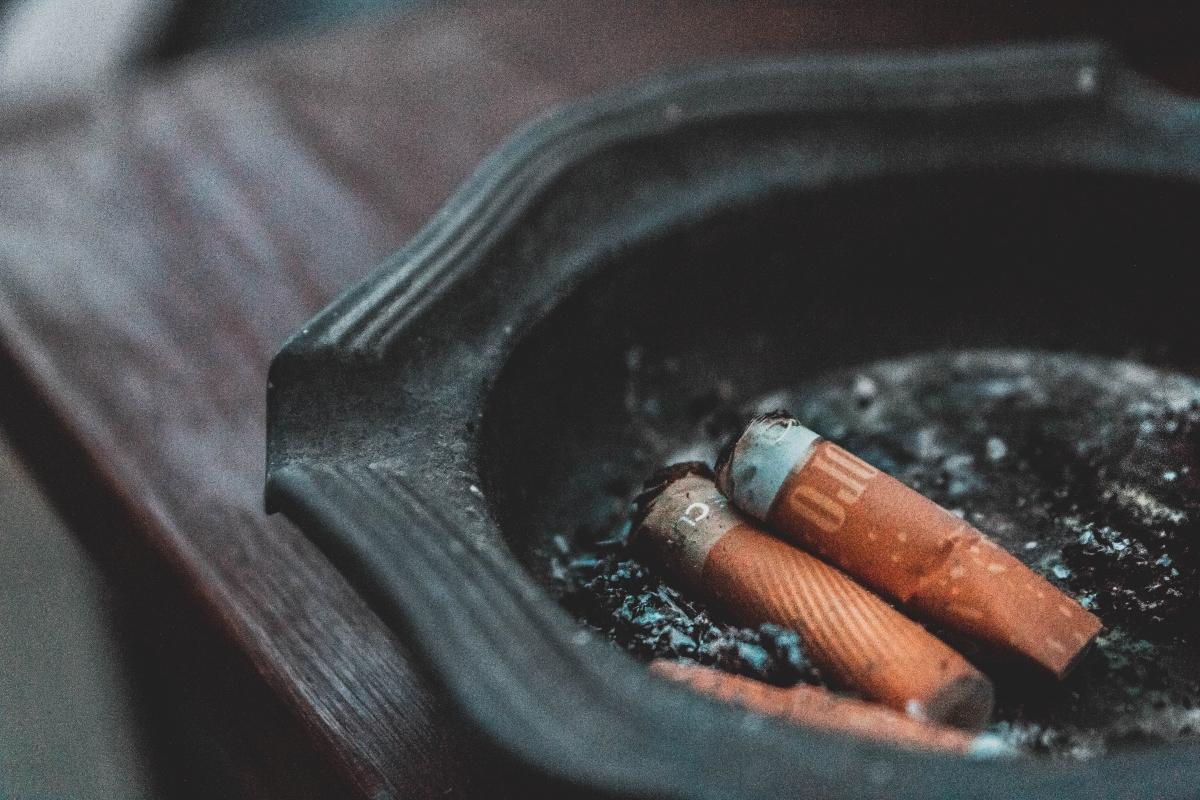 close-up of cigarette butts in tray