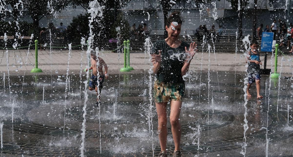 Children playing in fountain