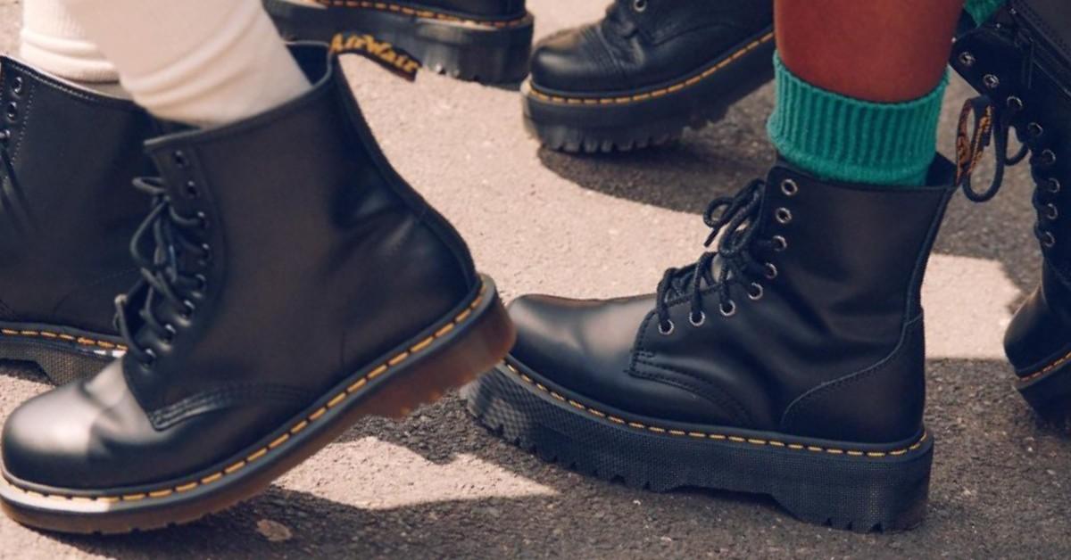 A closeup of people walking while wearing Dr. Martens shoes