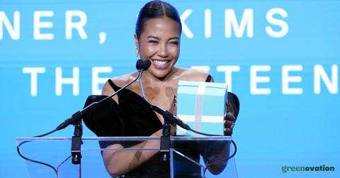 Emma Grede standing at a podium giving a speech