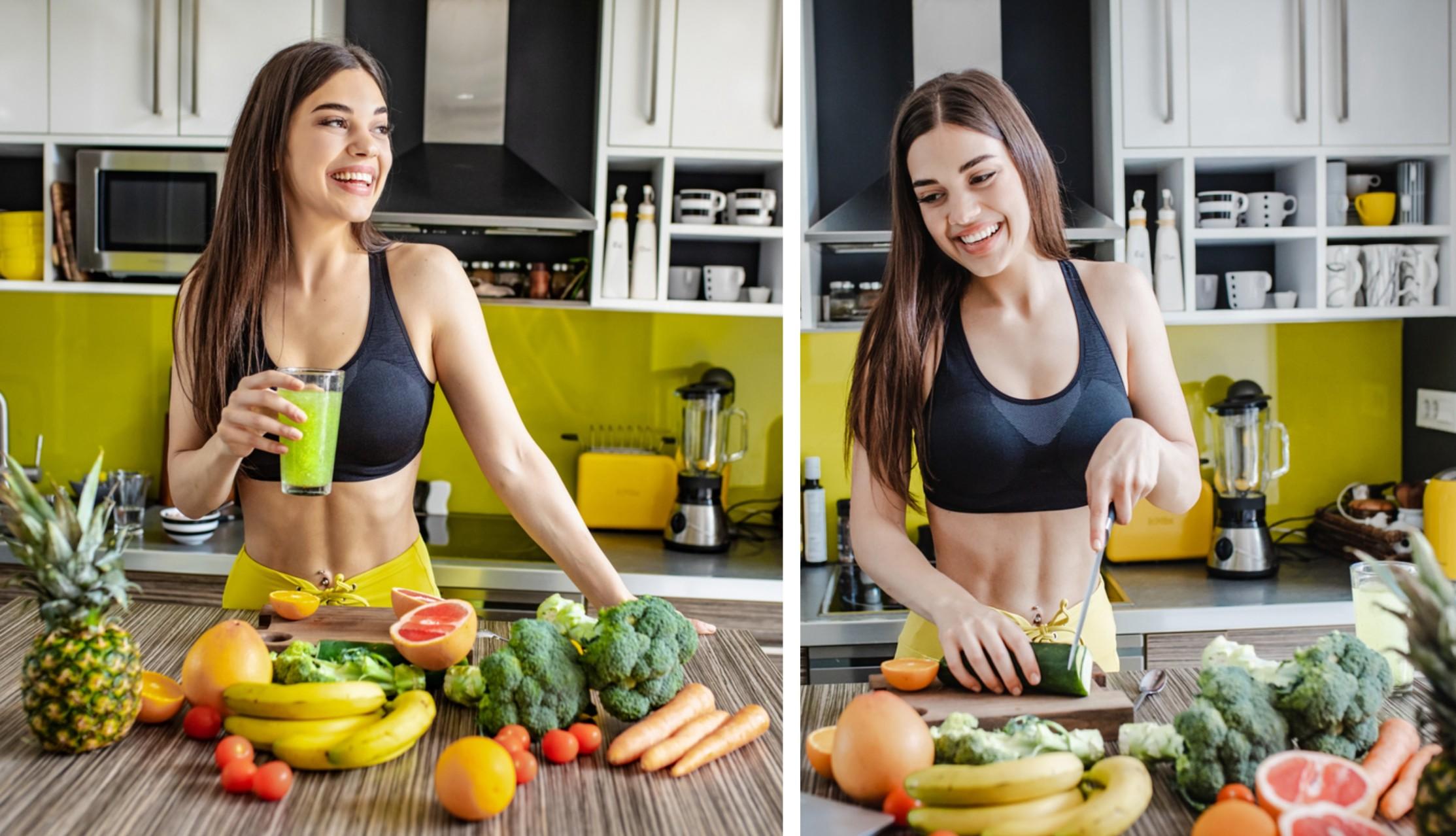 A smiling vegan athlete prepares a fruit and vegetable meal in the kitchen.