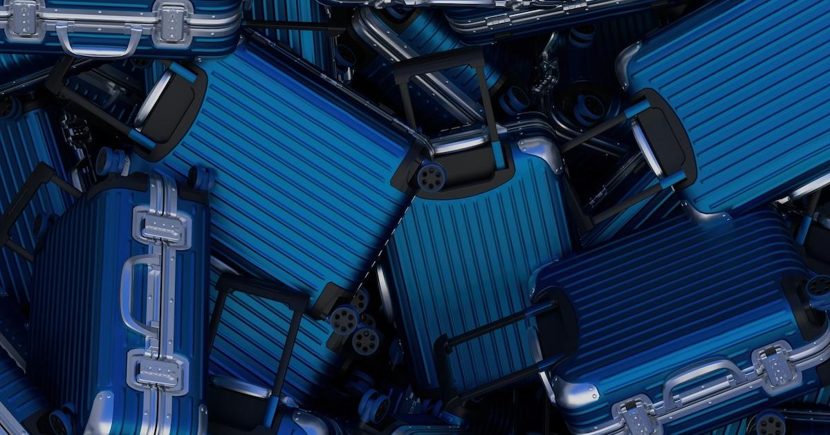 Pile of various blue suitcases