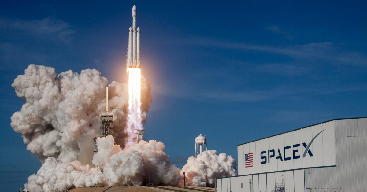 A giant cloud of smoke sits at the bottom of a SpaceX rocket 