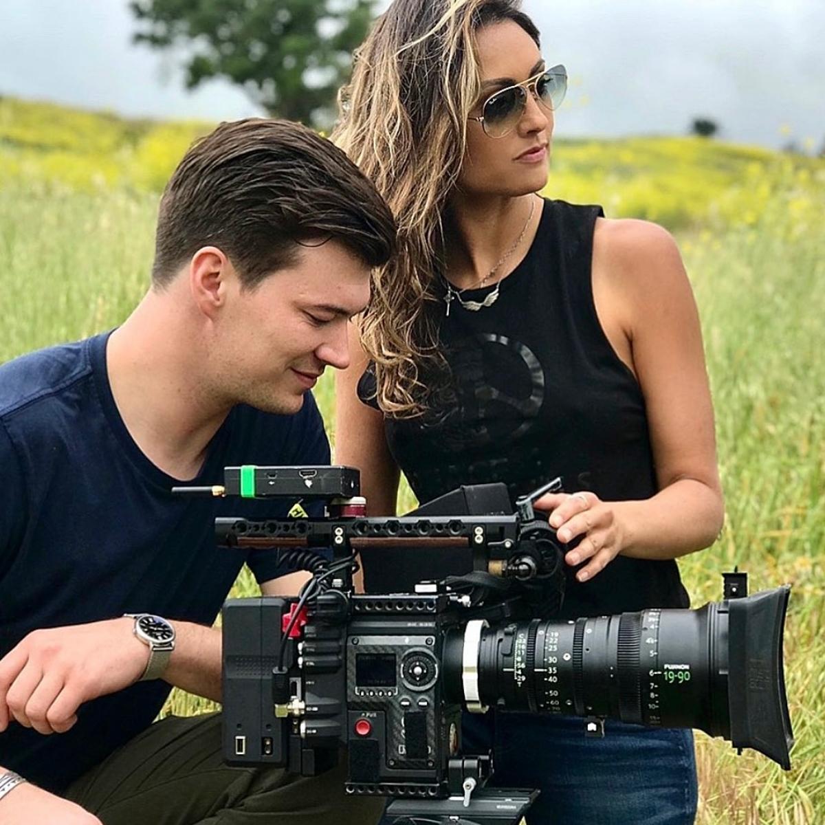 Katie Cleary filming a documentary in nature