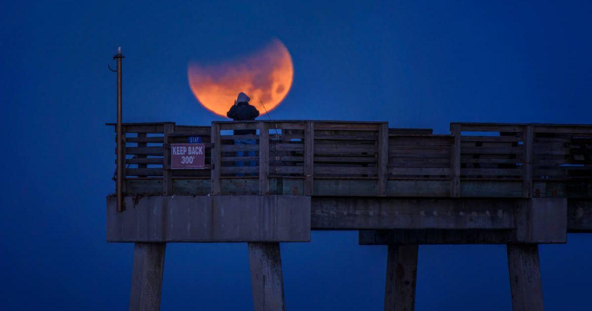 A man taking a photo of a supermoon. (Representative Cover Image Source: Getty Images | Diana Robinson Photography)