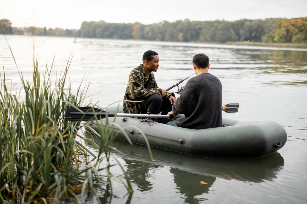 men fishing on river