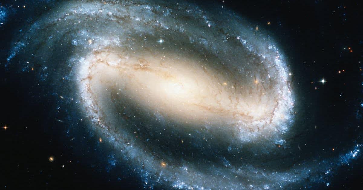 Portrait of a spiral galaxy with a stellar bar at the nucleus. (Representative Cover Image Source: Getty Images | Stocktrek)