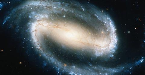Portrait of a spiral galaxy with a stellar bar at the nucleus. (Representative Cover Image Source: Getty Images | Stocktrek)
