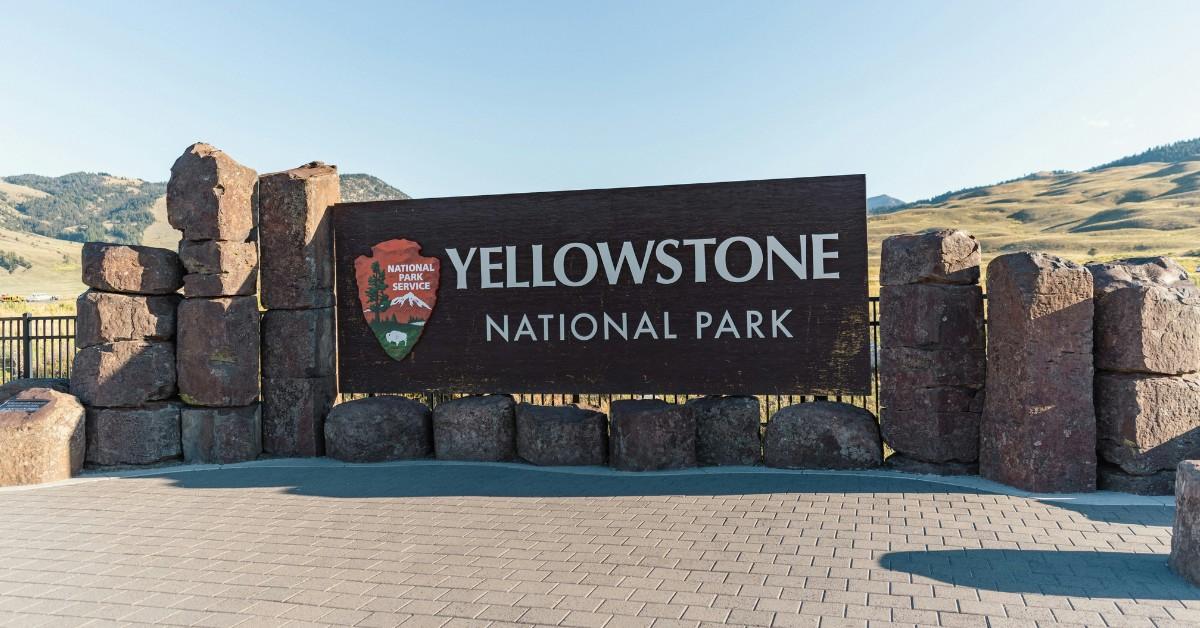 A sign hangs at the enterance to Yellowstone National Park