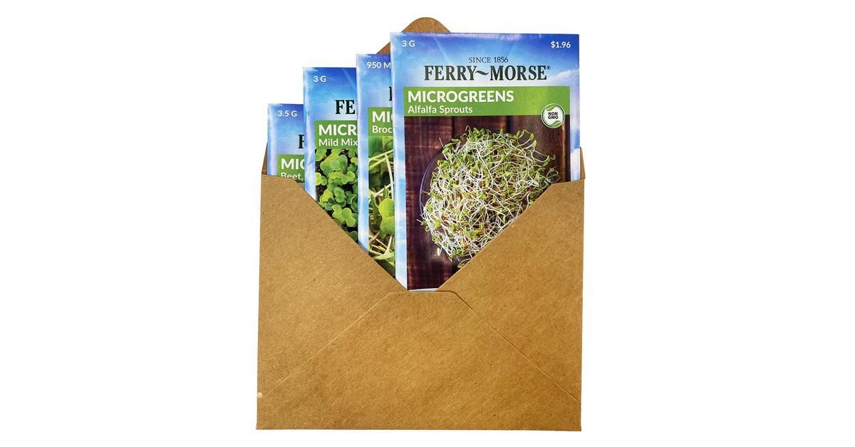 Four microgreens seed packets in a brown envelope