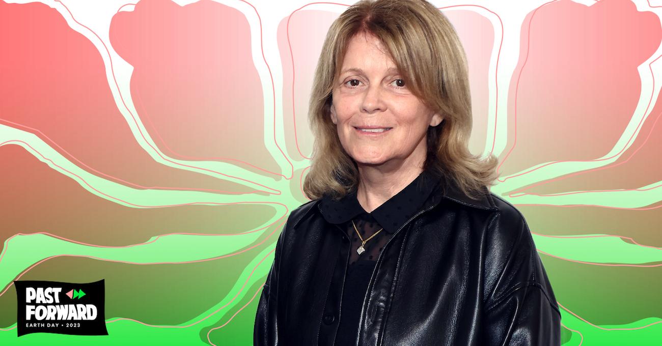 Kathleen Rogers smiles at the camera in a black jacket, on an illustrated background of a green and pink design.