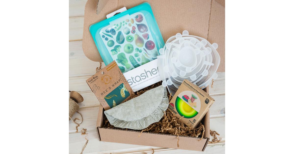 cardboard box filled with reusable food storage bags and wraps