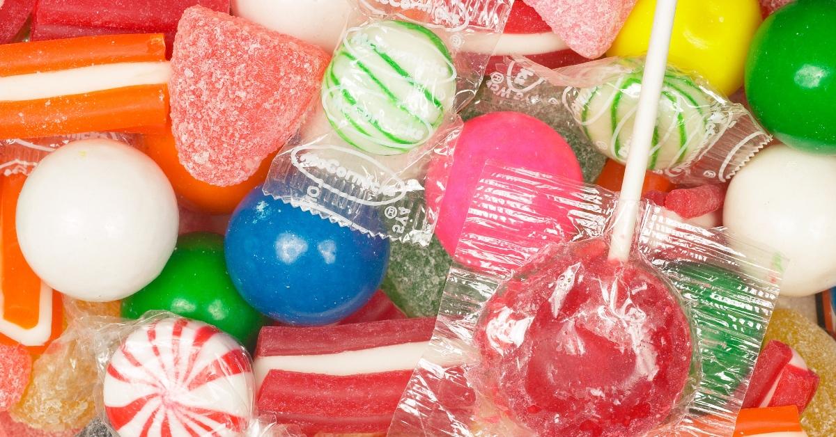 Pile of multicolored candies wrapped in plastic.