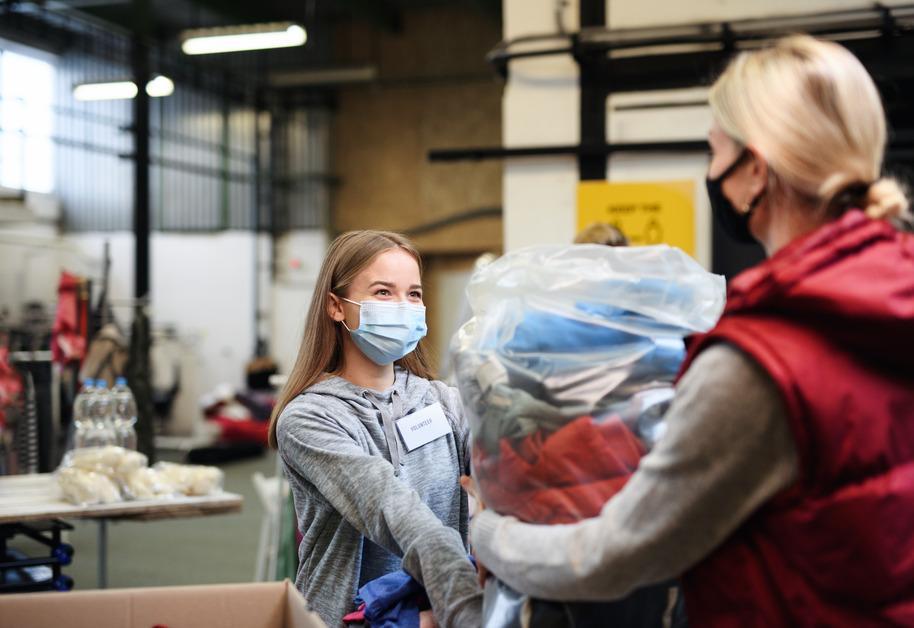 Woman Donating Clothes