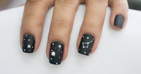 Stock photo of celestial black nails.