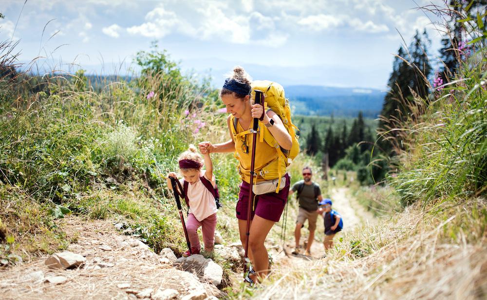 A family hiking during the day.