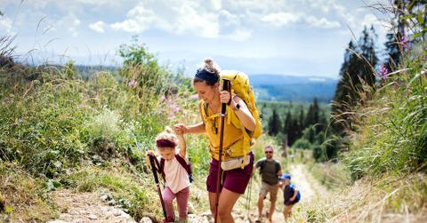 A family hiking during the day.