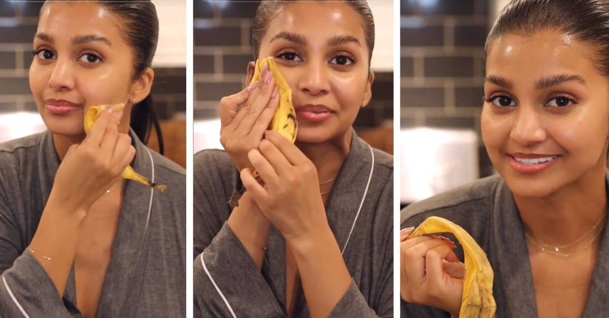 A woman uses a banana peel on her face, rubbing it in areas where she has fine lines and wrinkles