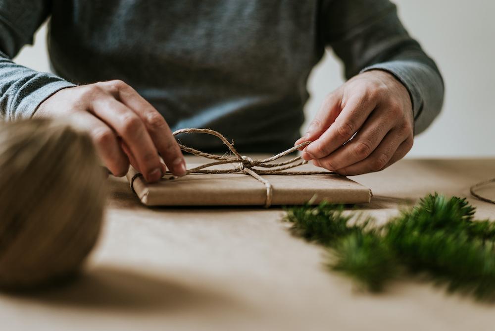 Hands wrapping a gift