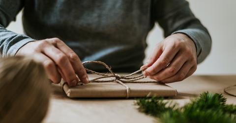 Hands wrapping a gift
