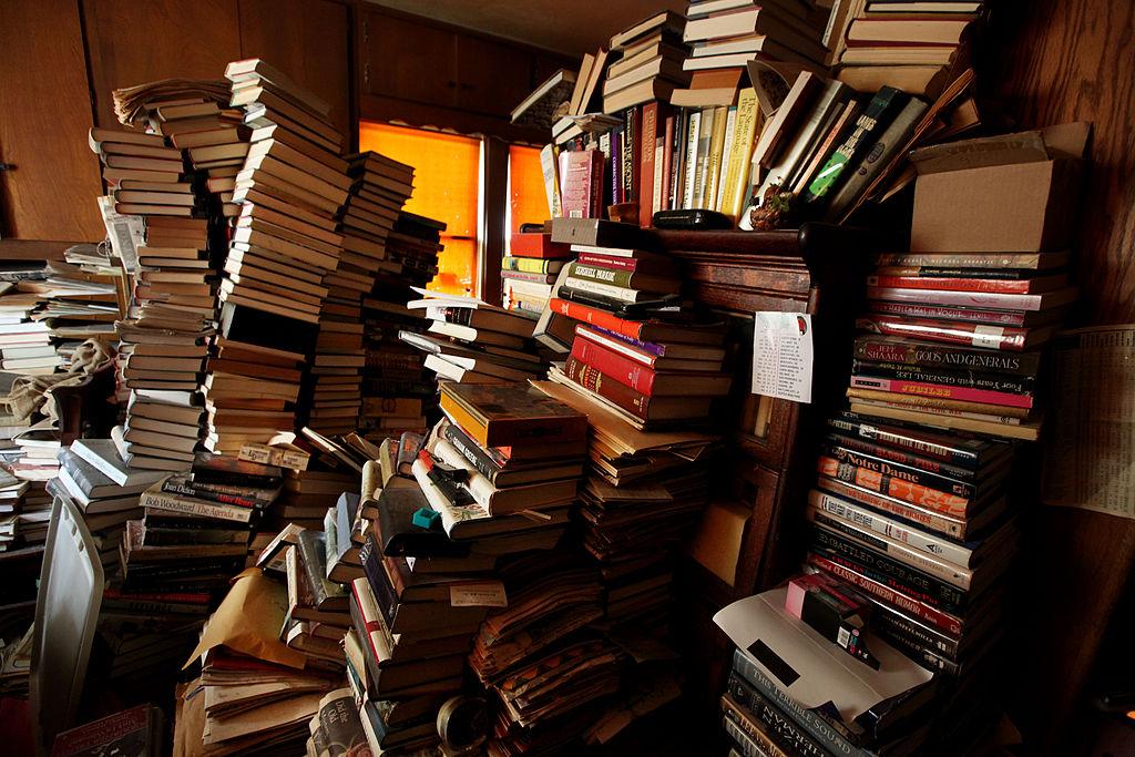 Books are stacked inside a bedroom at a hoarder's home in April 2011 in San Diego, California.