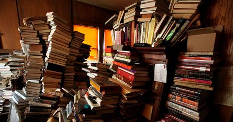 Books are stacked inside a bedroom at a hoarder's home in April 2011 in San Diego, California.