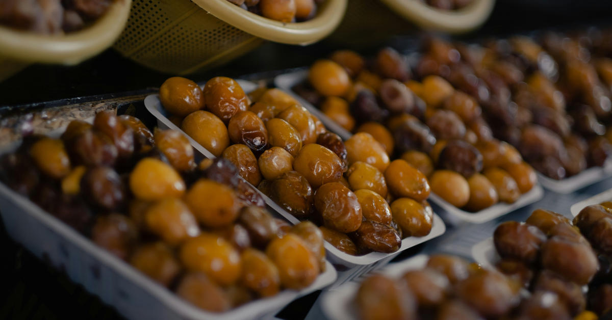 Fresh dates sit in containers in a store