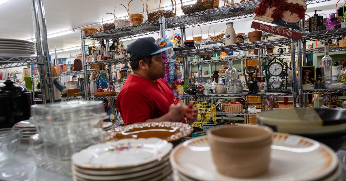 Person browses homewares in a thrift store