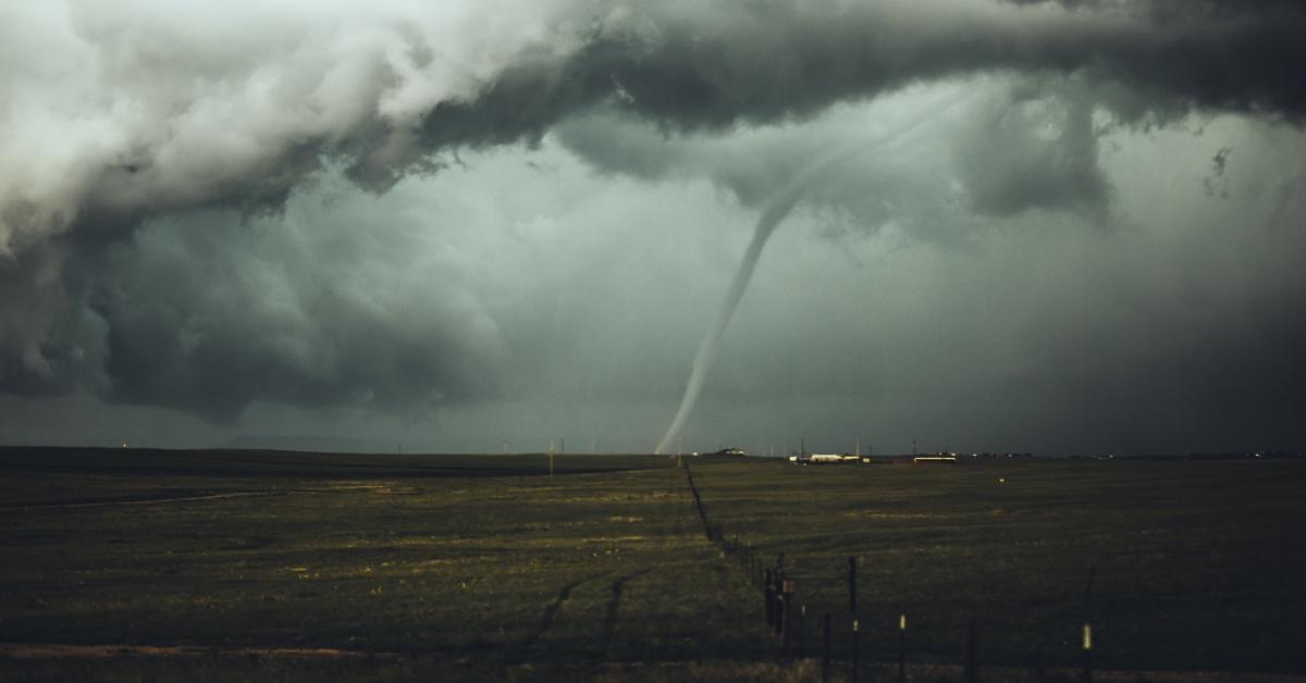 Tornado in the distance of farmlands