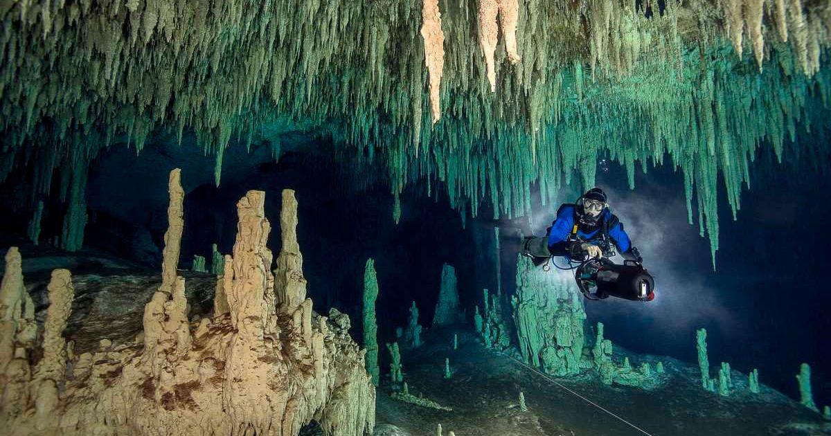 Innards of a beautiful cavern brimming with stalactites and stalagmites (Representative Cover Image Source: Getty Images | Westend61)