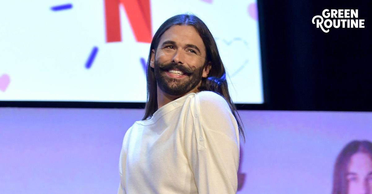 Jonathan Van Ness on a stage in a white top