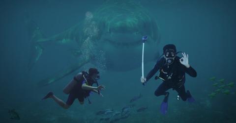 Close-up shot of a predatory shark swimming in ocean water with divers. (Representative Cover Image Source: Pixabay | Image by Lothar Dieteric)
