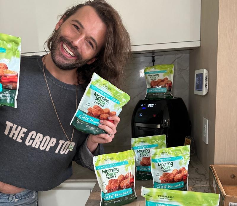 Jonathan Van Ness poses with MorningStar Farms' plant-based Chik'n Nuggets.