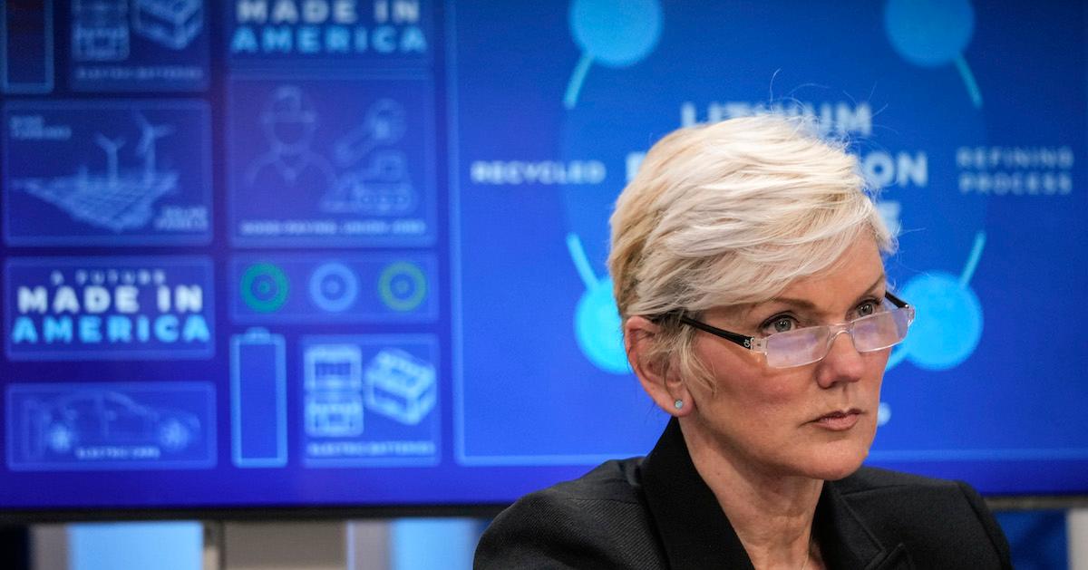 Jennifer Granholm sits in front of a screen