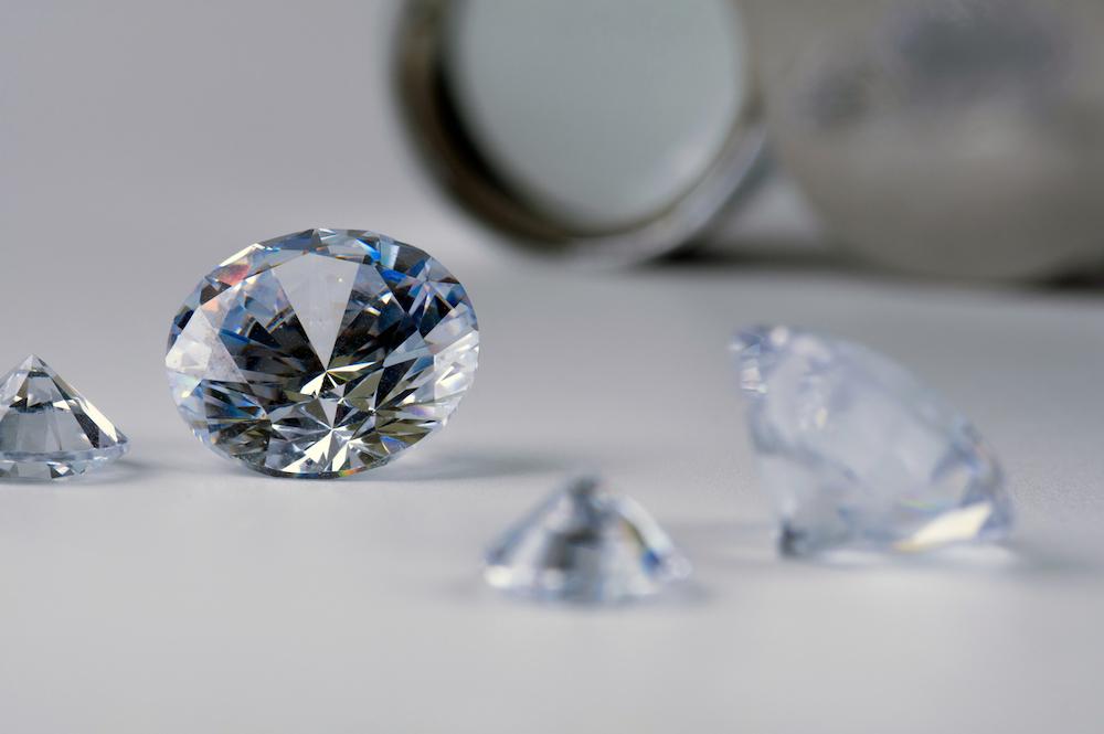 What is a simulated diamond how they differ from mined diamonds
