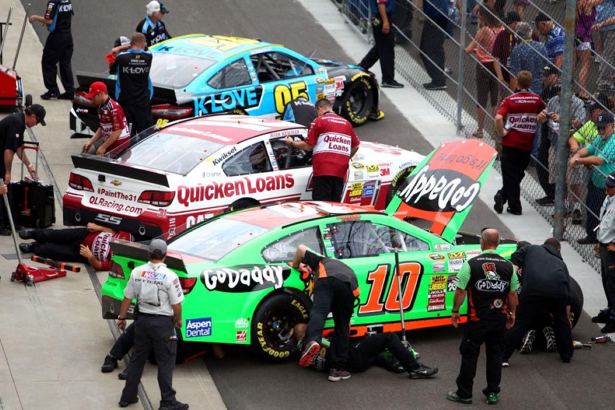 Mechanics getting cars ready for a NASCAR race.