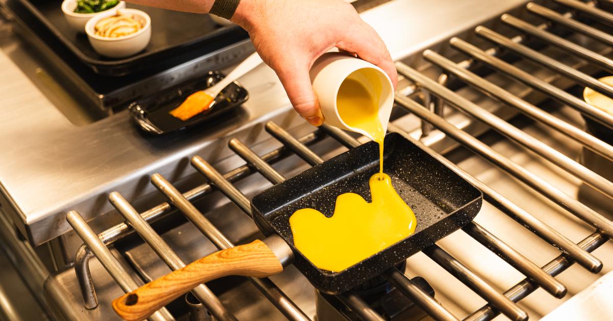 Photo of chef pouring the EVERY Company's EVERY Egg product into a small rectangular pan