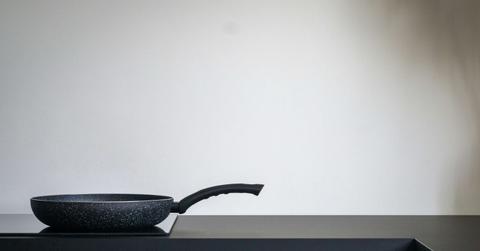 A nonstick frying pan is pictured on a countertop.