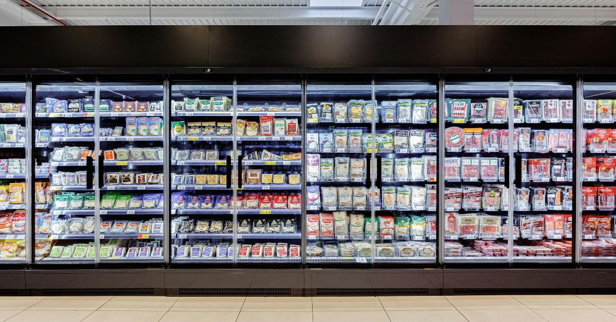 A wall of coolers at the grocery store
