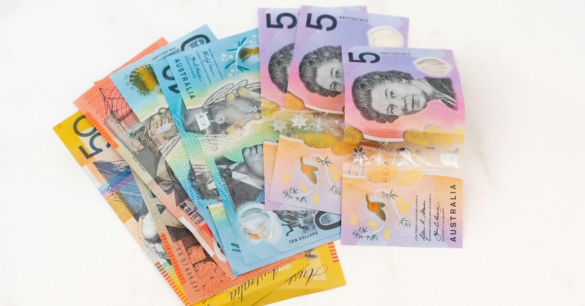 Australian money is fanned out across a table