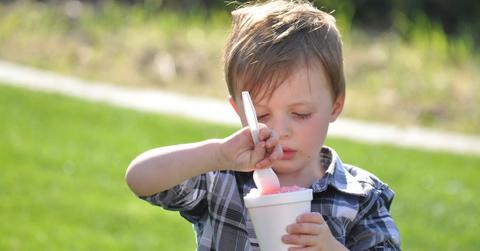 kid eating a frozen drink