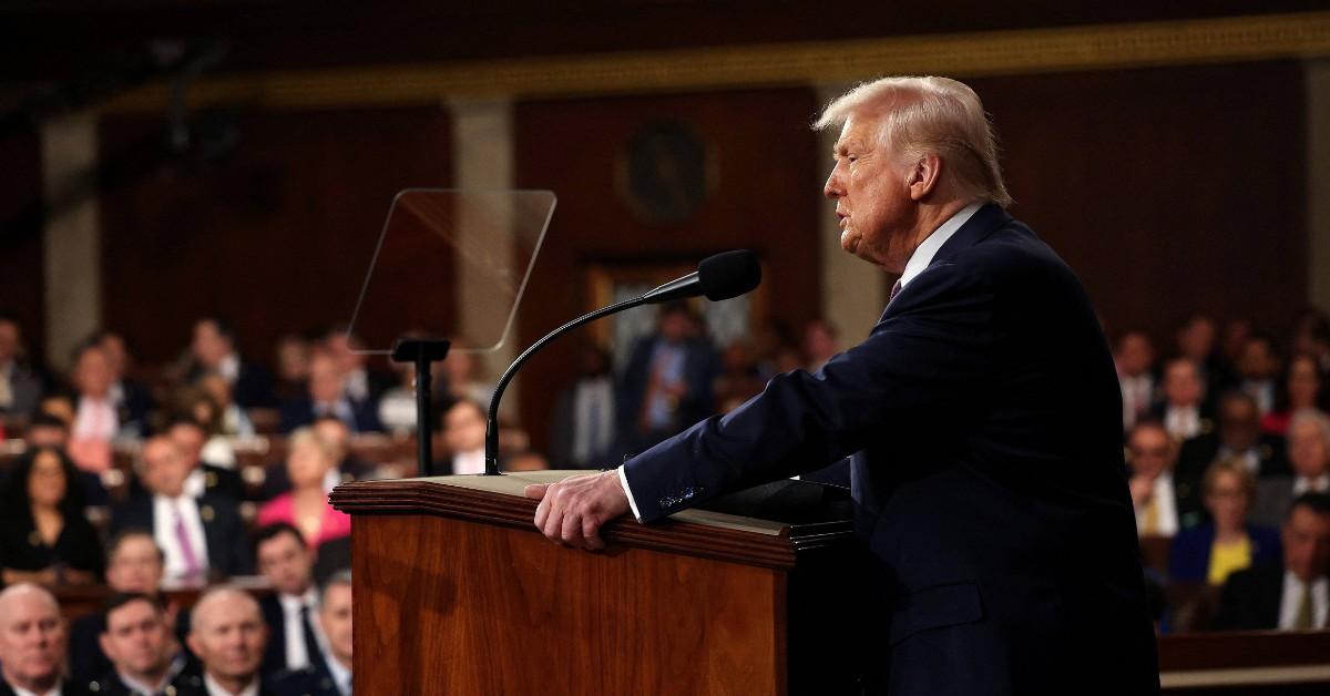 Donald Trump stands behind the podium at the State of the Union