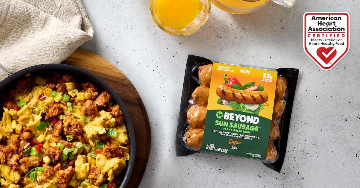 Package of Beyond Meat Sun Sausage in Cajun flavor next to a skillet of food