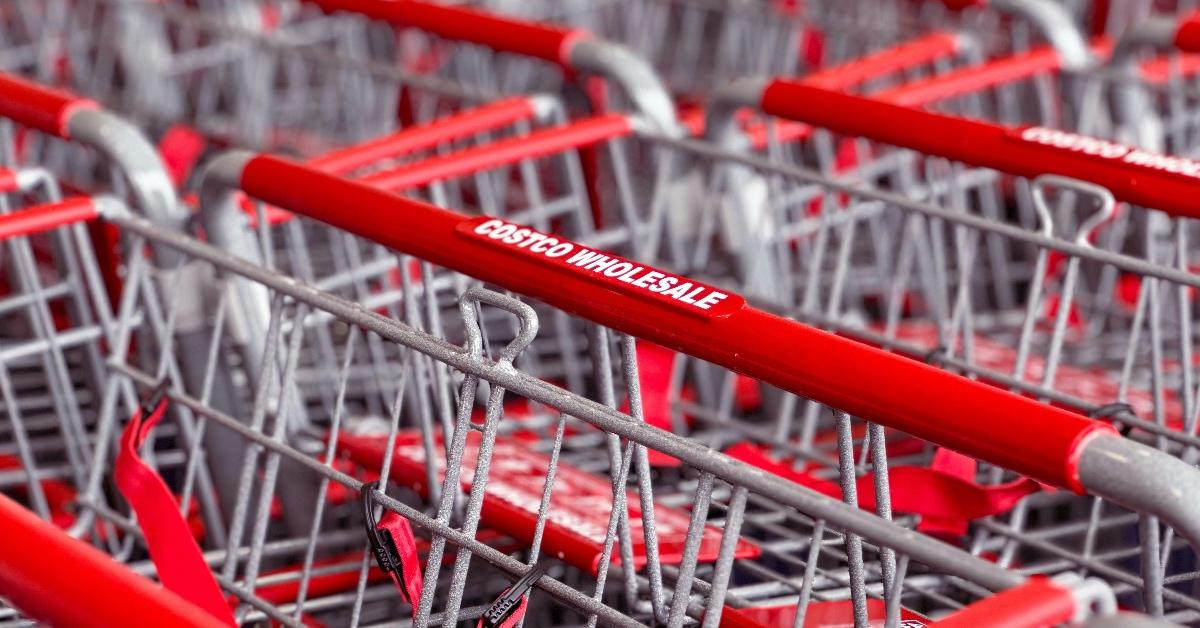 Close-up photograph of Costco red shopping cart handles. 