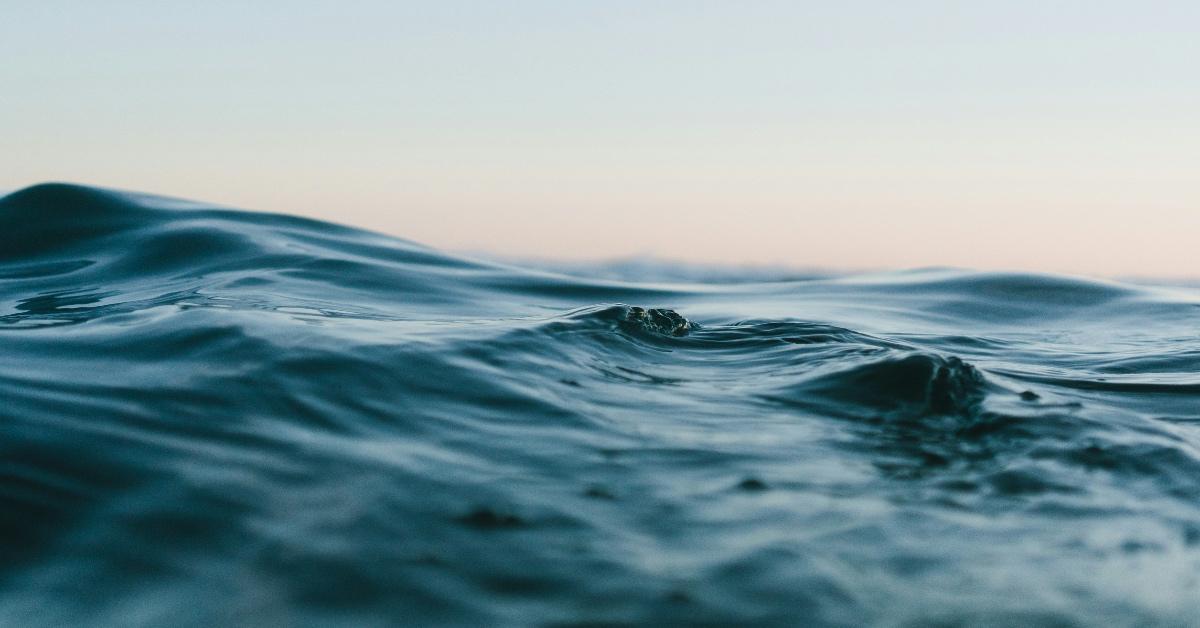 Ocean waves with a sunrise skyline