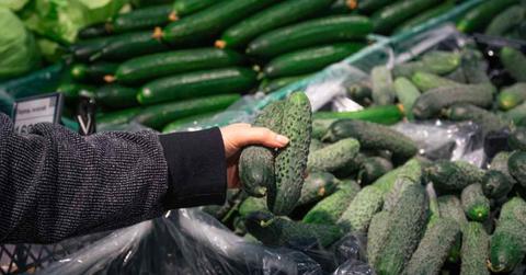 A person is picking up cucumbers in the market. (Representative Image Source: Freepik | PV Productions)