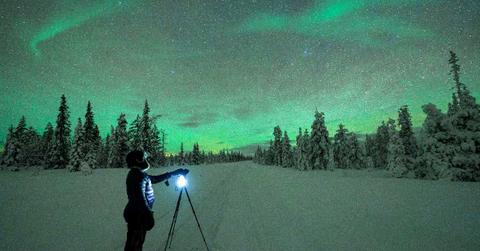 A man capturing the Northern Lights. (Representative Cover Image Source: Getty Images | Roberto Moiola | Sysaworld)