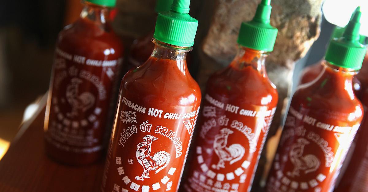 Sriracha bottles on a counter