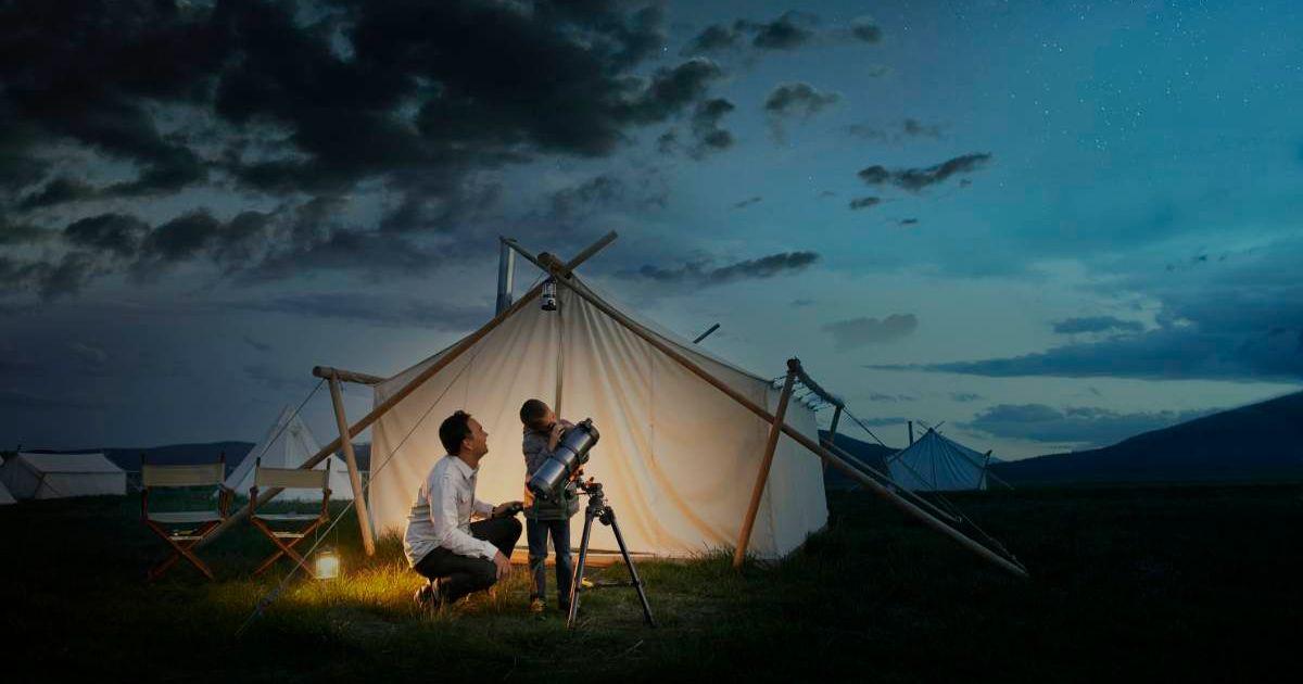 Father and child are looking through a telescope. (Representative Cover Image Source: Getty Images | Dana Neibert)