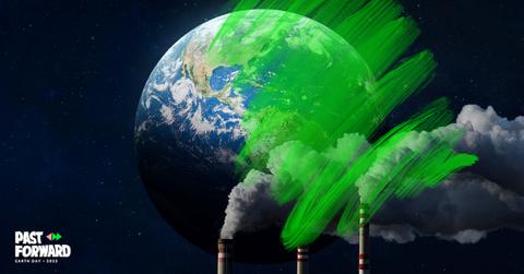 An image of Earth from space and smokestacks are partially obscured by a bright green drawing.